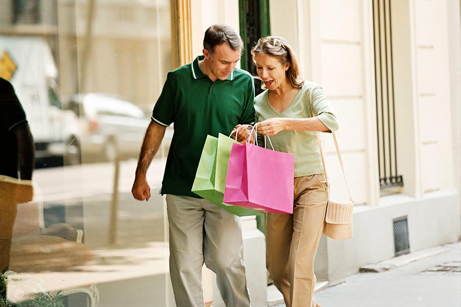 couple carrying shopping bags