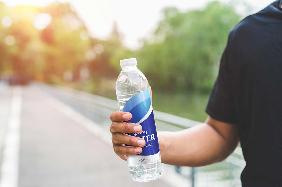 An image of a person holding a water bottle.