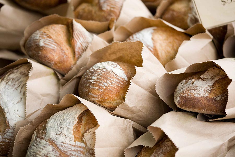 An image of bags of stacked bread.