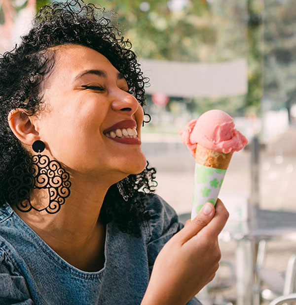 Woman smiling with ice cream cone