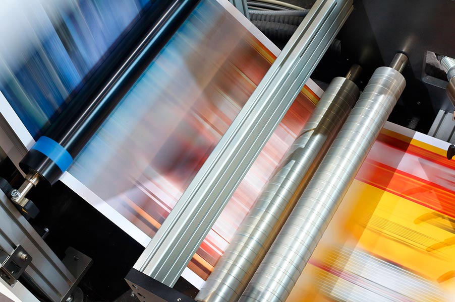 printed inkjet papers running through a high speed printer