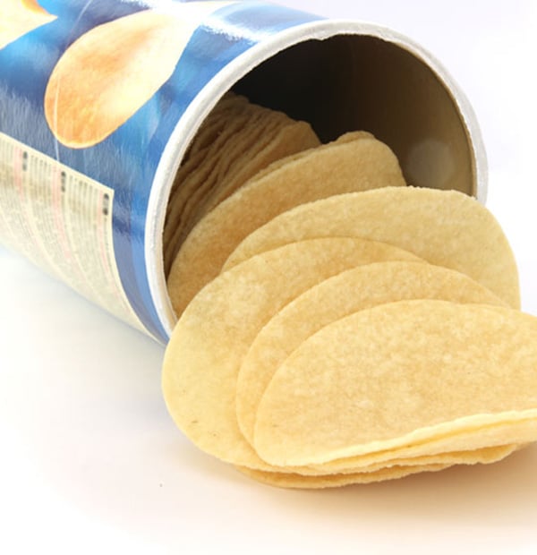 Potato chips spilling out of a canister